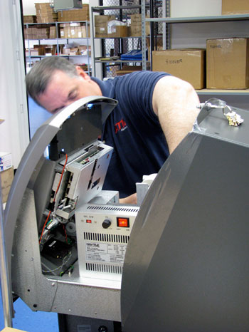 ATM Network technician working on a machine